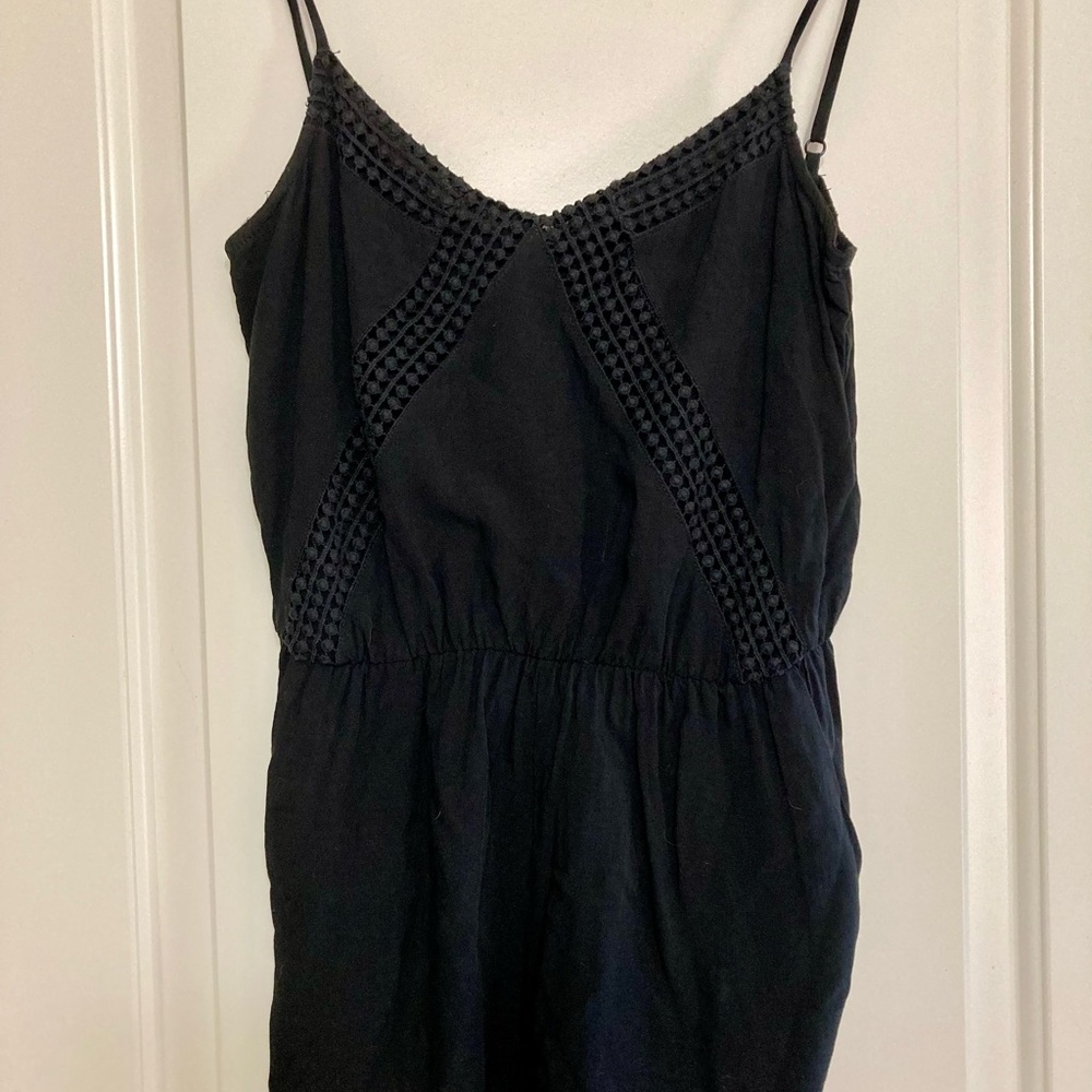 Black romper with textured details